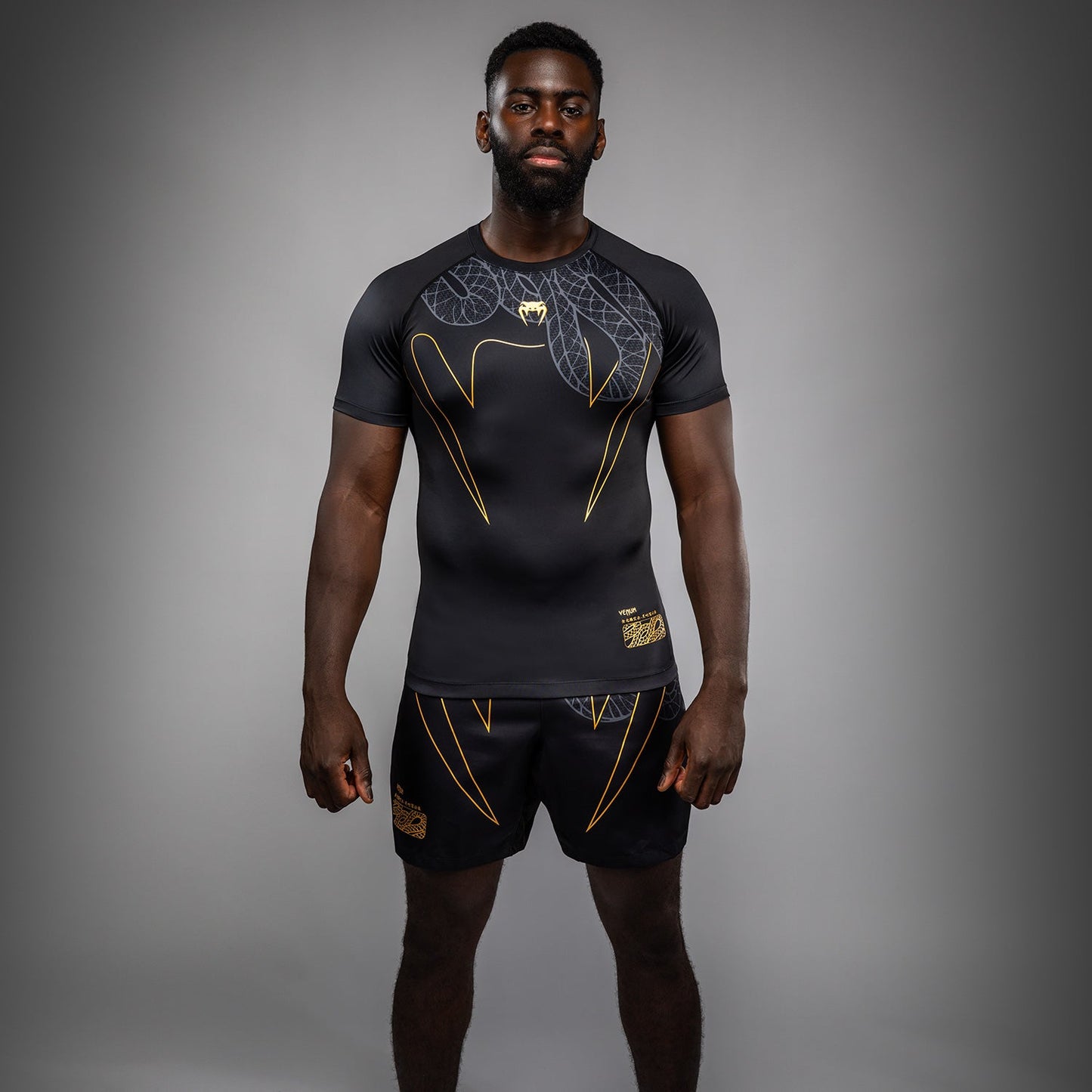 Venum Serpenti Kurzarm Rashguard – Schwarz/Silber/Gold
