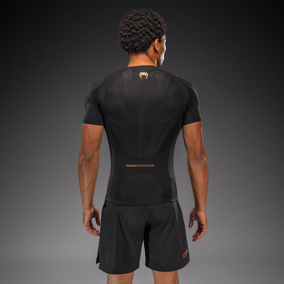 Venum G-Fit Revolution Kurzarm-Rashguard - Schwarz/Kupfer